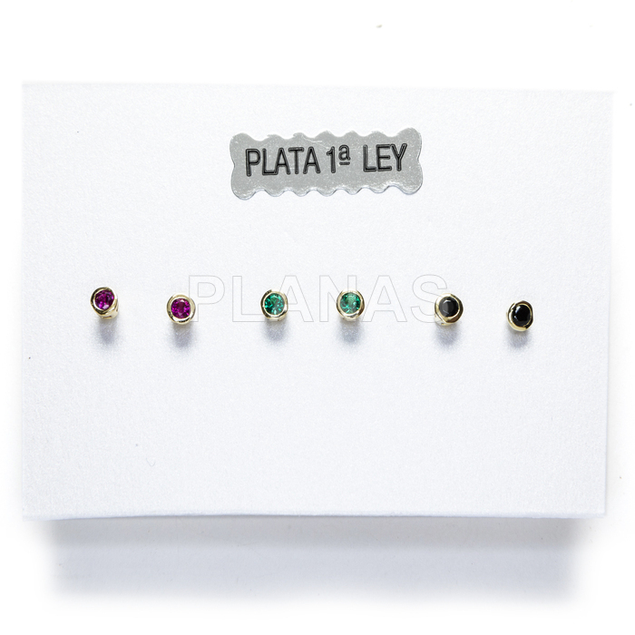 Display of 3pr earrings in sterling silver and gold plated with colored zircons.