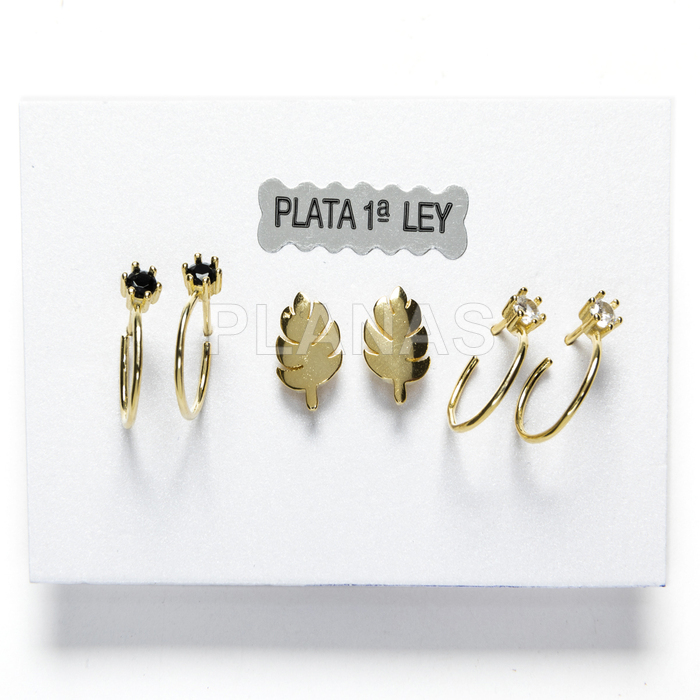 Earrings in sterling silver and gold plated with zircons.
