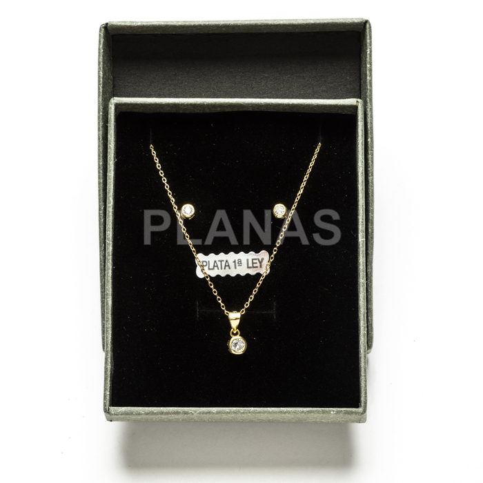 Set in sterling silver and gold plating with white zircons.