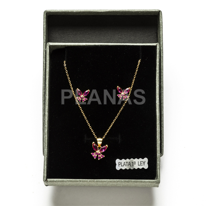 Set in sterling silver and gold plating with fuchsia zircons. butterfly.