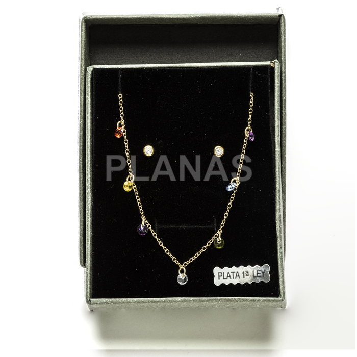 Set in sterling silver and gold plating with colored zircons.
