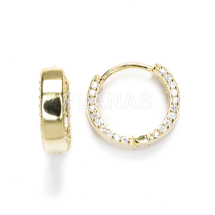 Hoops in sterling silver and gold plated with white zircons.