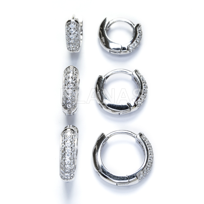 Hoops in rhodium-plated sterling silver and white zirconia. 