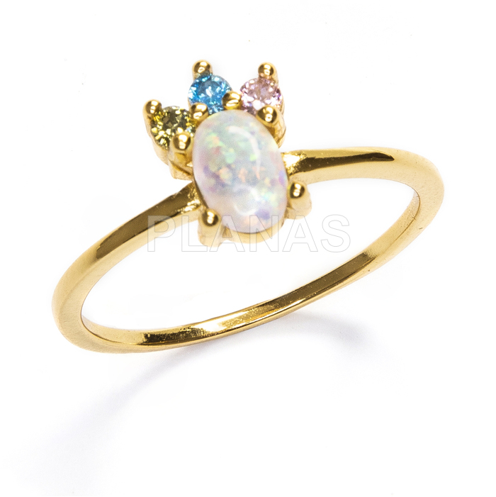 Ring in sterling silver with opal and zirconias gold plated with 1 micron. 