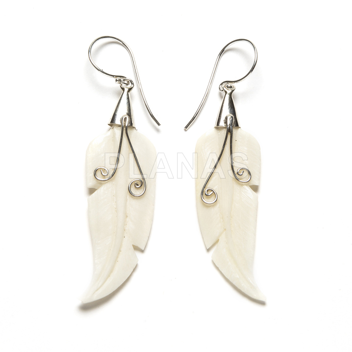 Earrings in bone and sterling silver. feather.