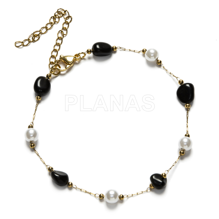 Tornozeleira em aço inoxidável e banhada a ouro com ágata preta e pérola de concha.  