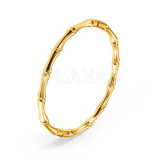 Pulseira rígida em aço inoxidável e banhada a ouro.