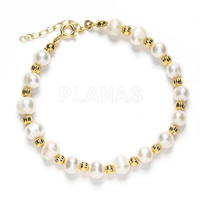 Pulseira em prata de lei e banhada a ouro com pérolas cultivadas de 6mm.