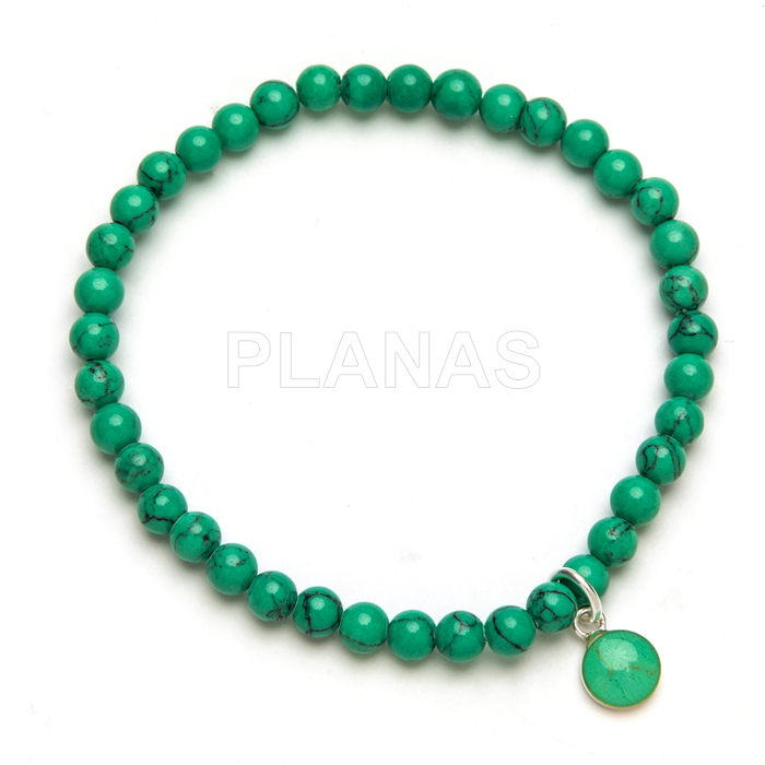 Pulseira elástica em prata de lei e turquesa.  