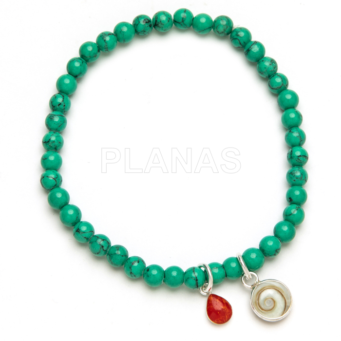 Pulsera elástica en plata de ley y Turquesa. CORAL Y CHIVA.