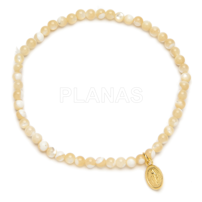 Pulseira elástica em prata de lei com banho de ouro e madrepérola. milagrosa.
