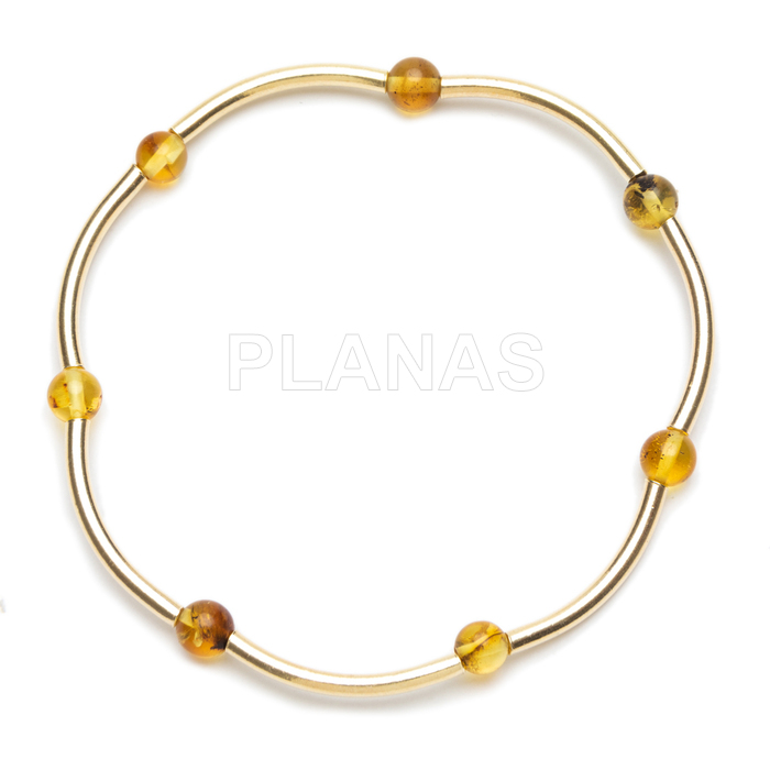 Pulseira elástica em prata de lei com banho de ouro e contas de âmbar de 4mm.