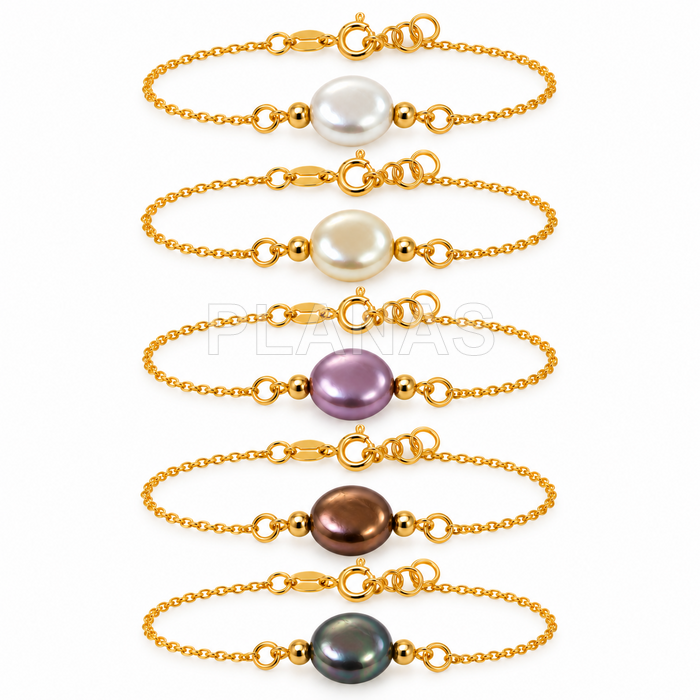 Pulseira em prata de lei com banho de ouro e um componente de pérola swarovski de 10 mm.